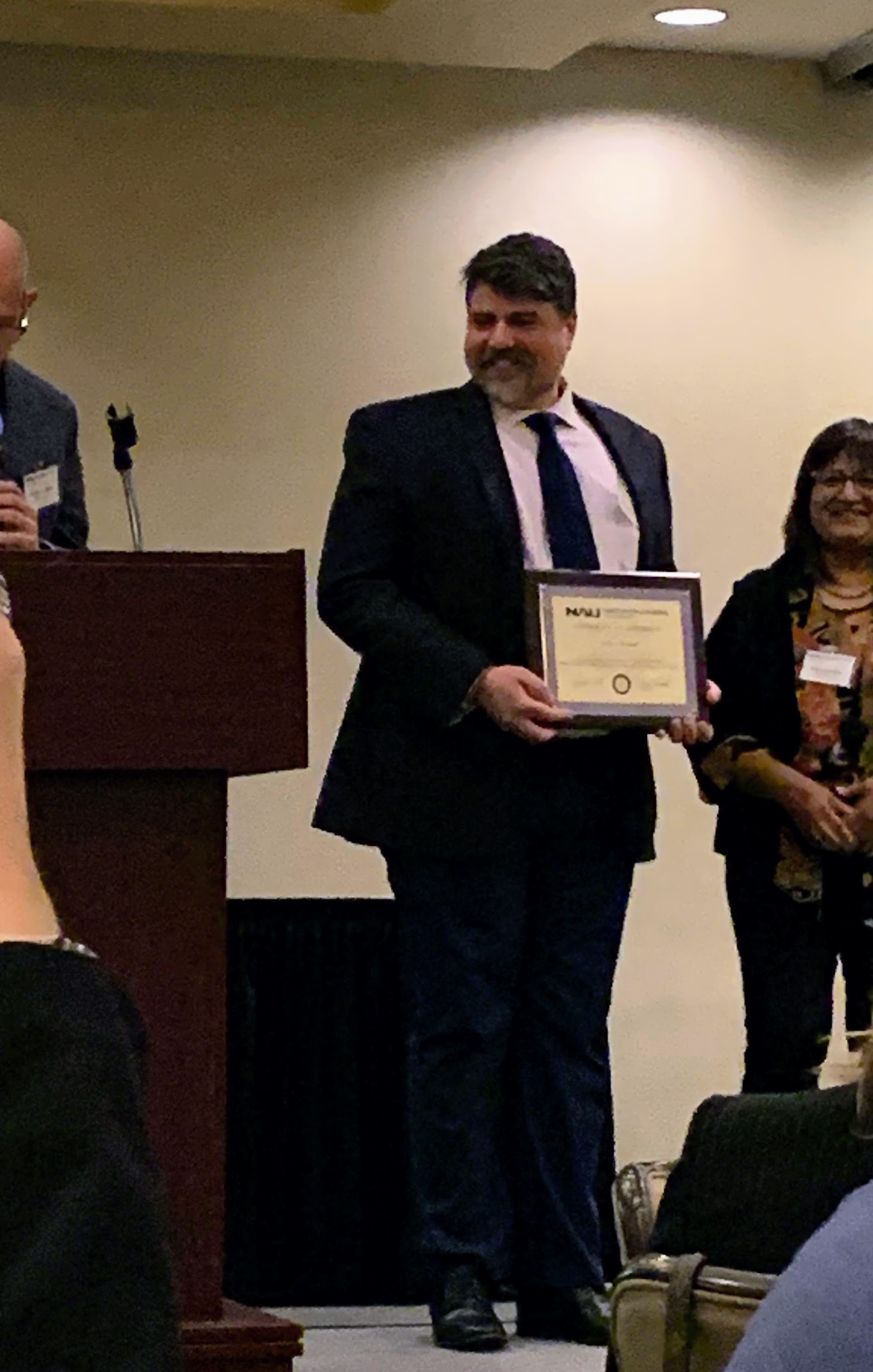 Andrew Horvath receiving the NAU College of Education Outstanding Master's Student award